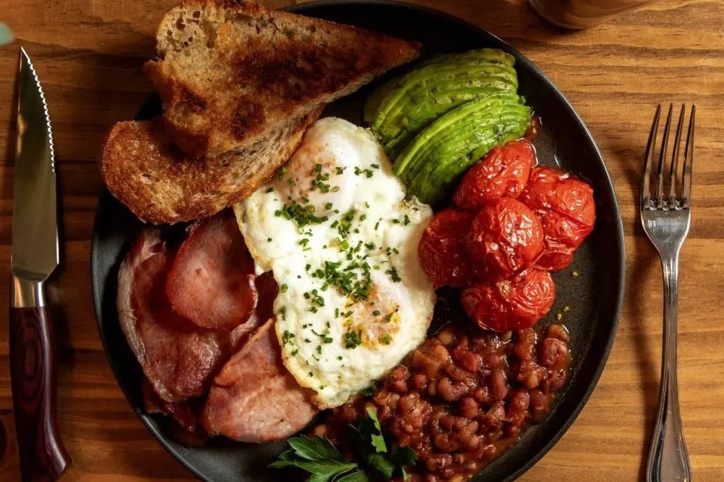 Chapel Street signature dishes Avo Toast, Full Australian, Chicken + Waffles.